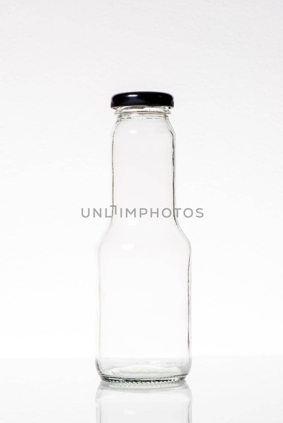 clear glass bottle isolated on white background