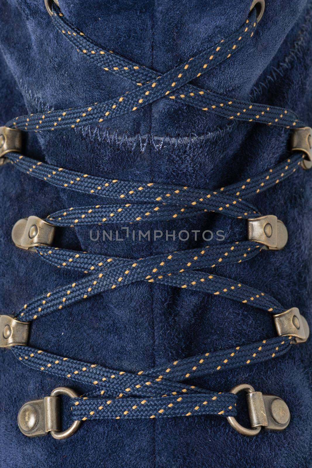 closeup detail of blue suede shoes and shoelace