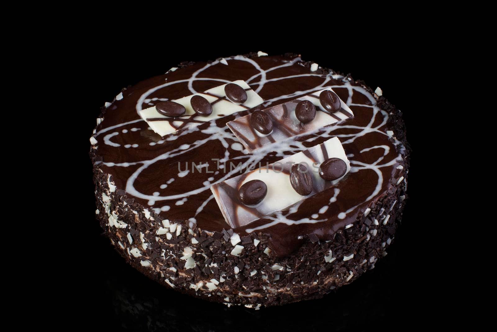 Chocolate cake with coffee beans on a black background
