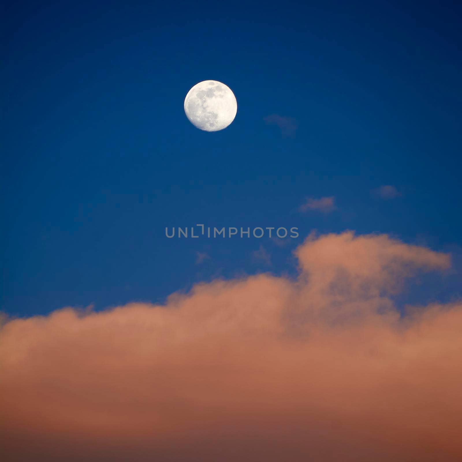 Moon in blue sky with white clouds by raul_ruiz