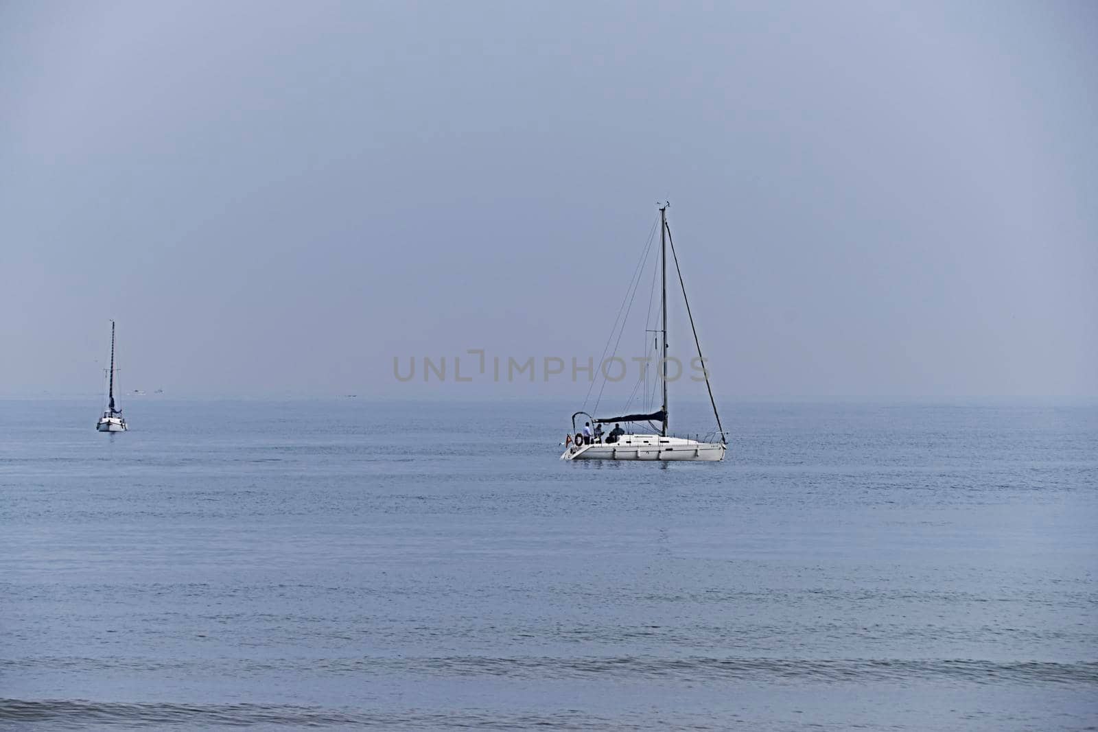Two sailboats sailing in calm waters, group, sea, ocean, no contrast