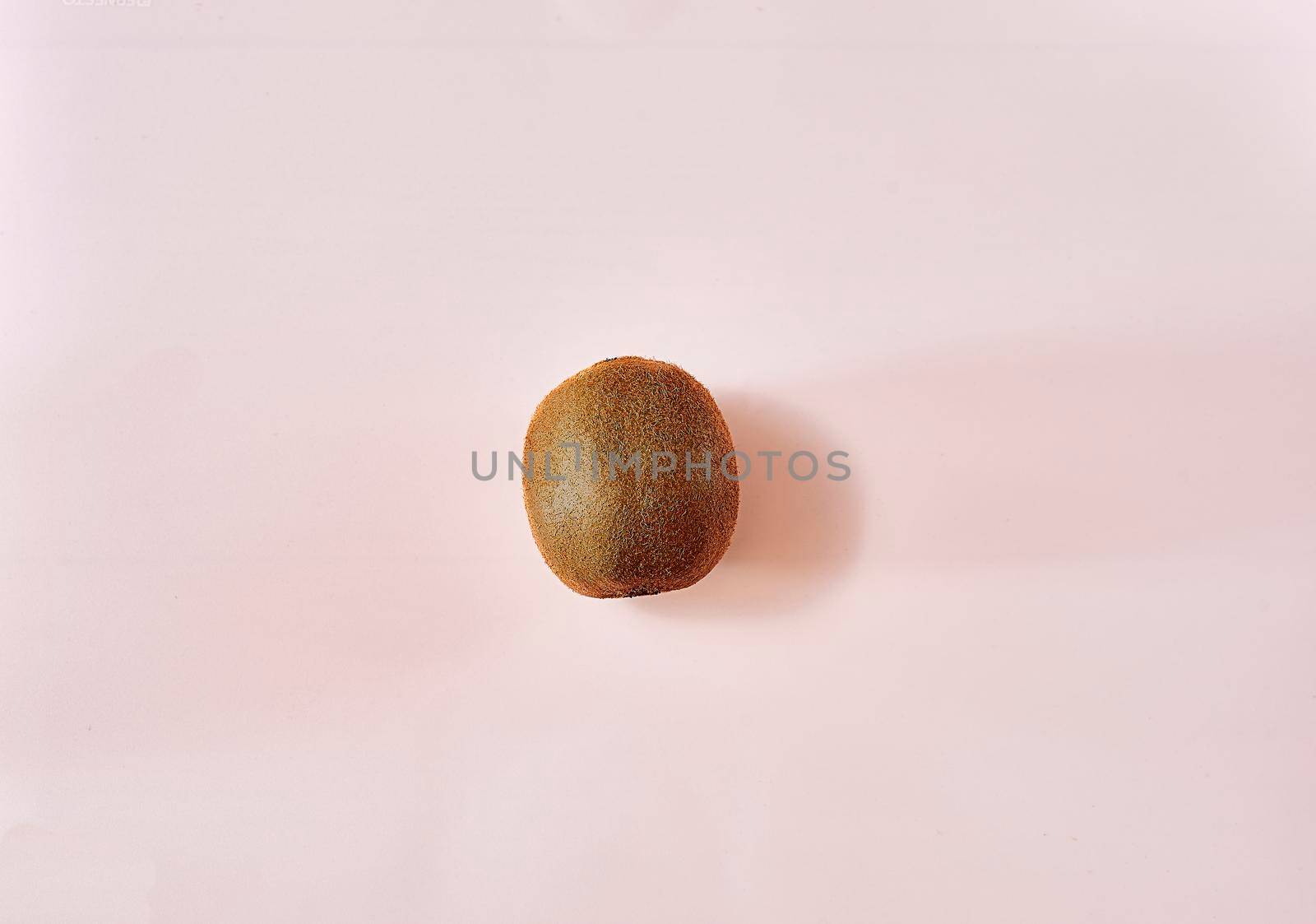 Kiwi in the middle of a white background. unique, bright, clean, empty space.