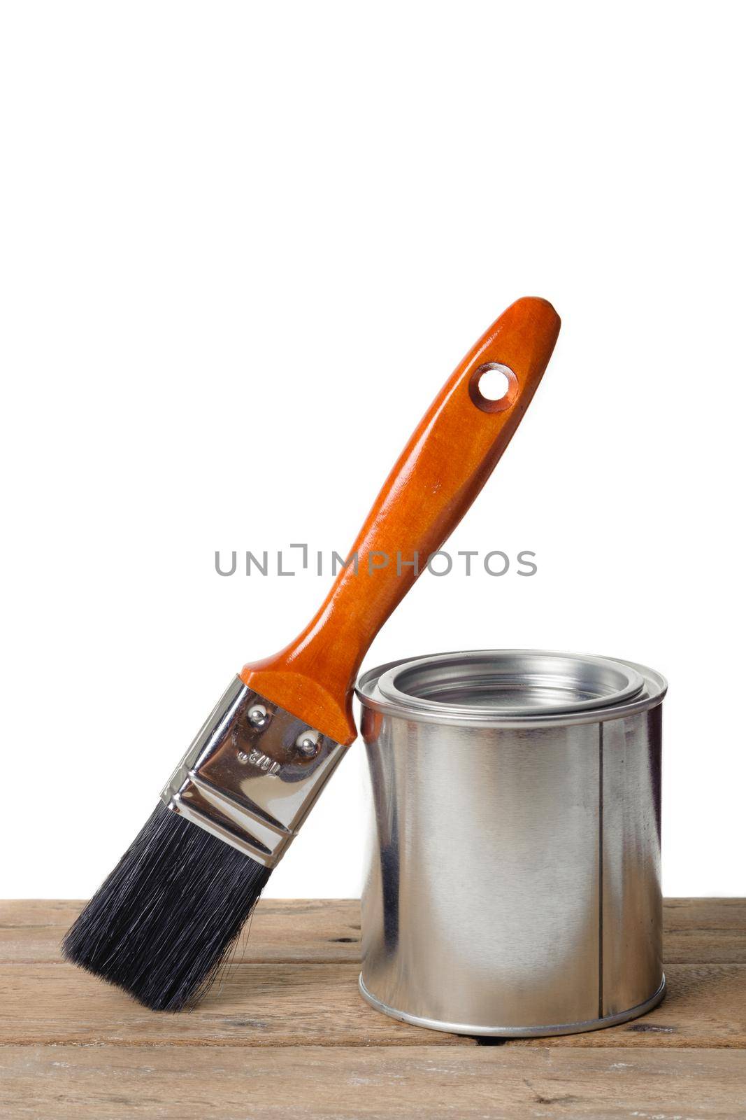 closeup new paintbrush with wooden handle over white background