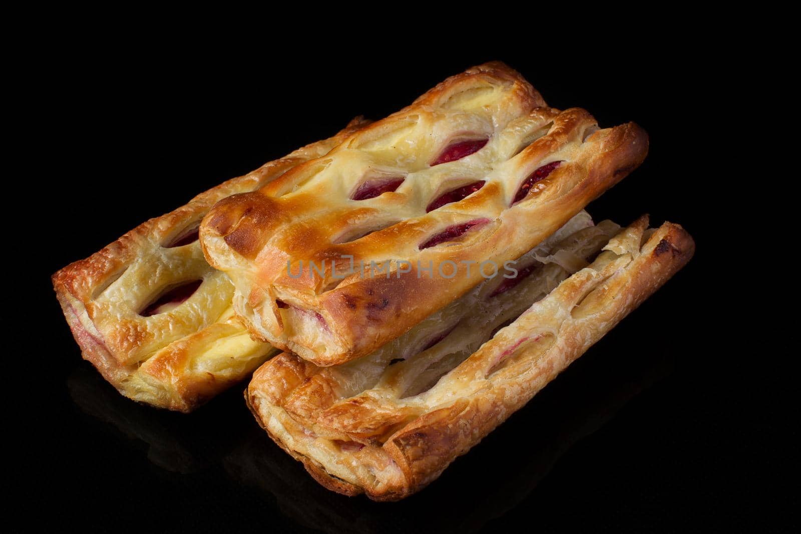 Puff pastry with jam on a dark background