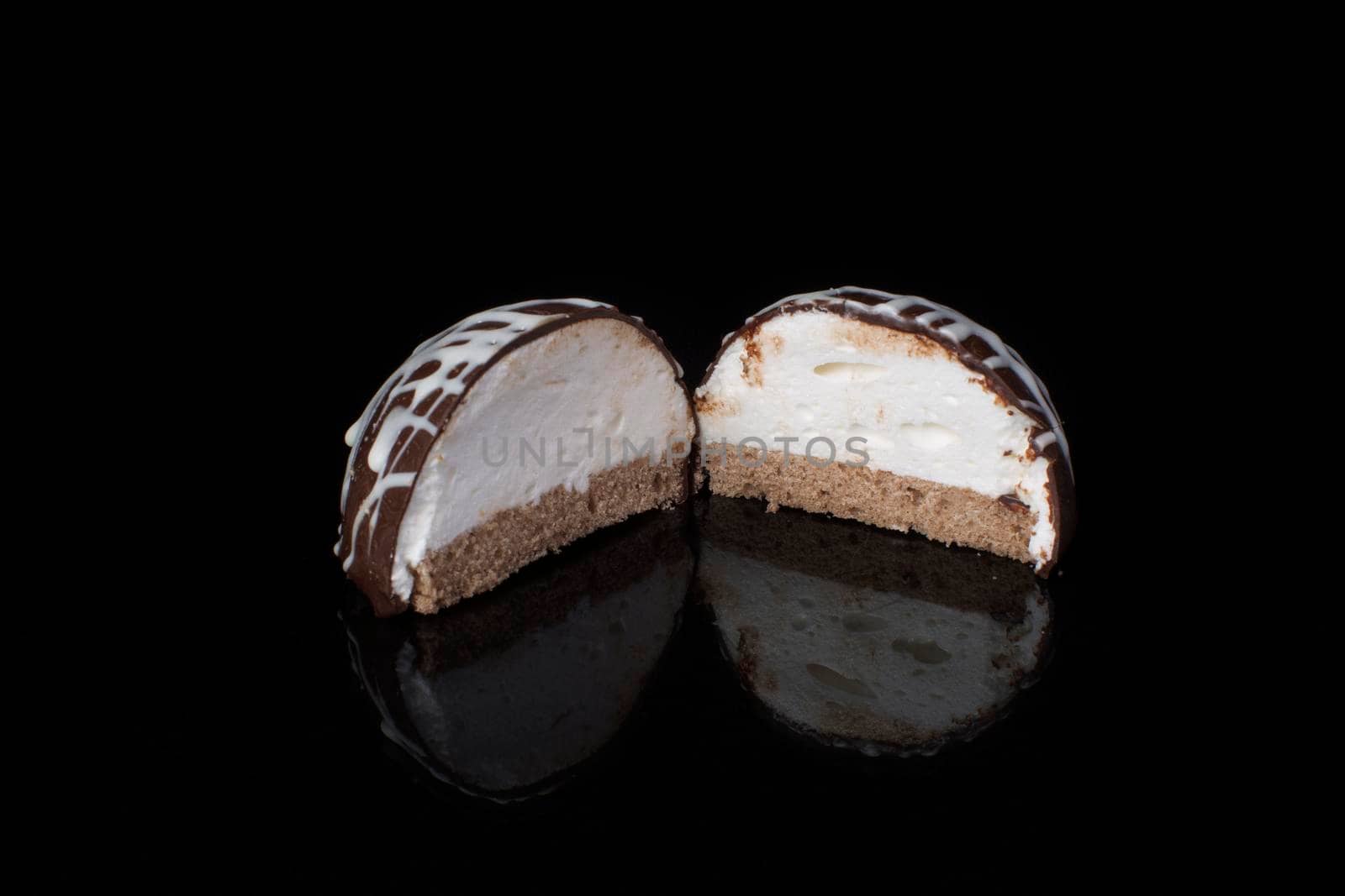 Small chocolate cakes on a black background.Brownie