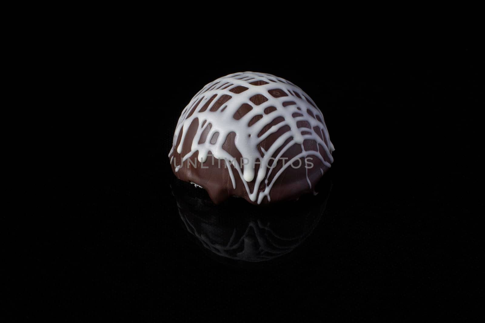 Small chocolate cakes on a black background.Brownie