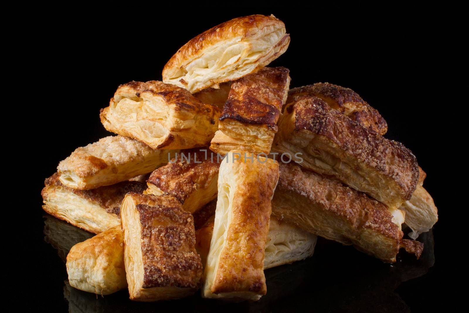 Puff pastry cookies on a black background
