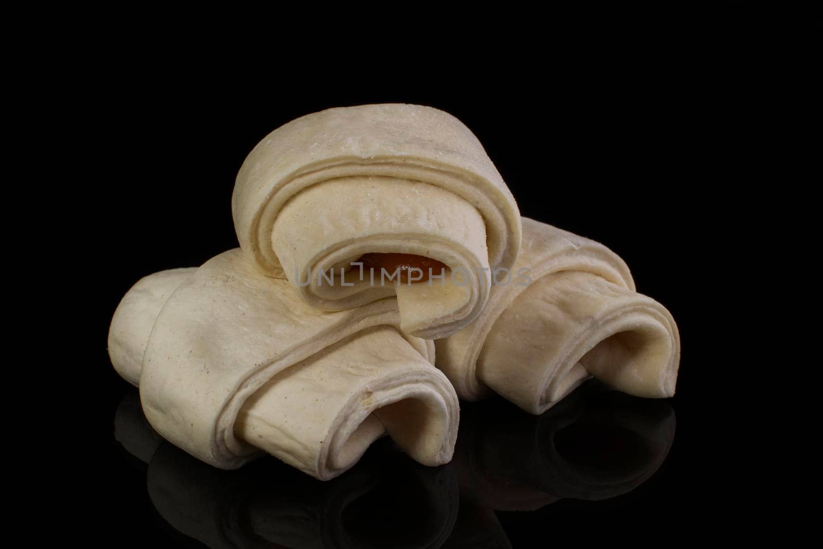 Bundled puff pastry with jam. Billets for baking