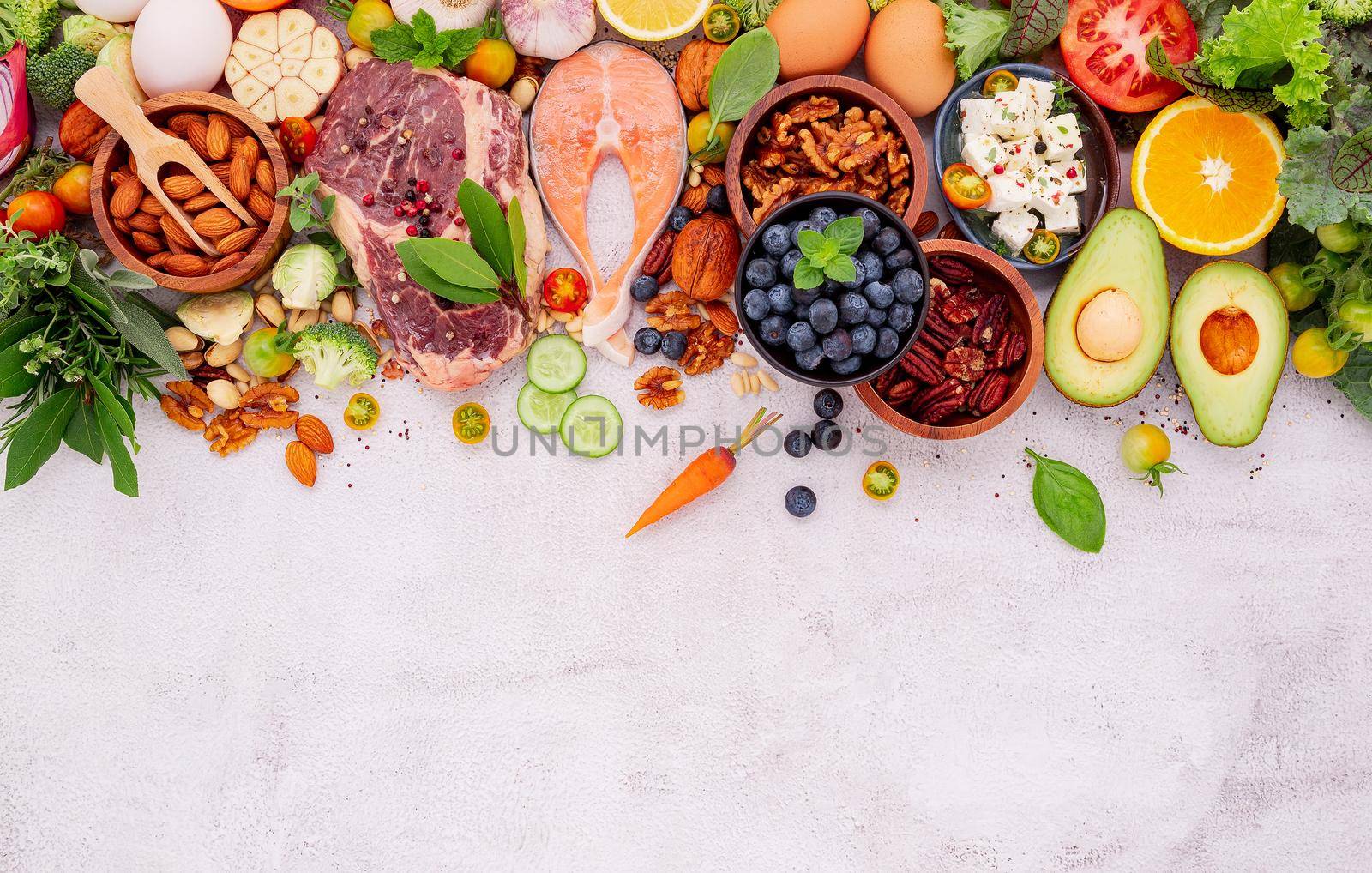 Ketogenic low carbs diet concept. Ingredients for healthy foods selection set up on white concrete background.  by kerdkanno