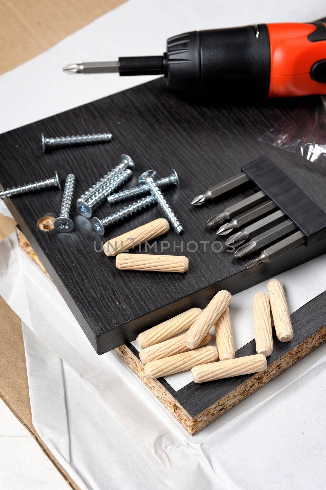 preparing for furniture installation with screws and bolts