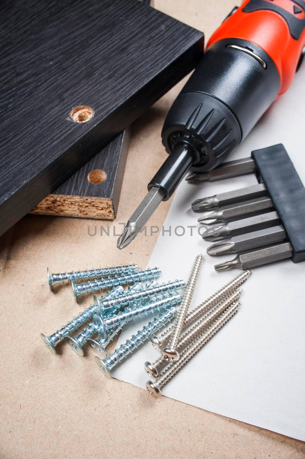 heap of screws and the screwdriver