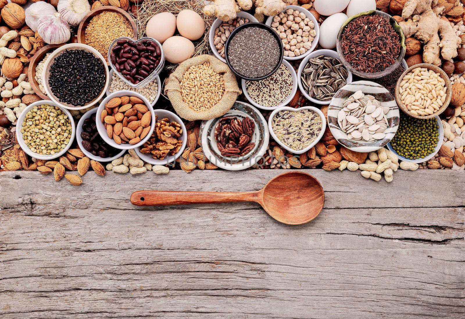 Ingredients for the healthy foods selection in ceramic bowl. The concept of superfoods set up on white shabby wooden background with copy space.