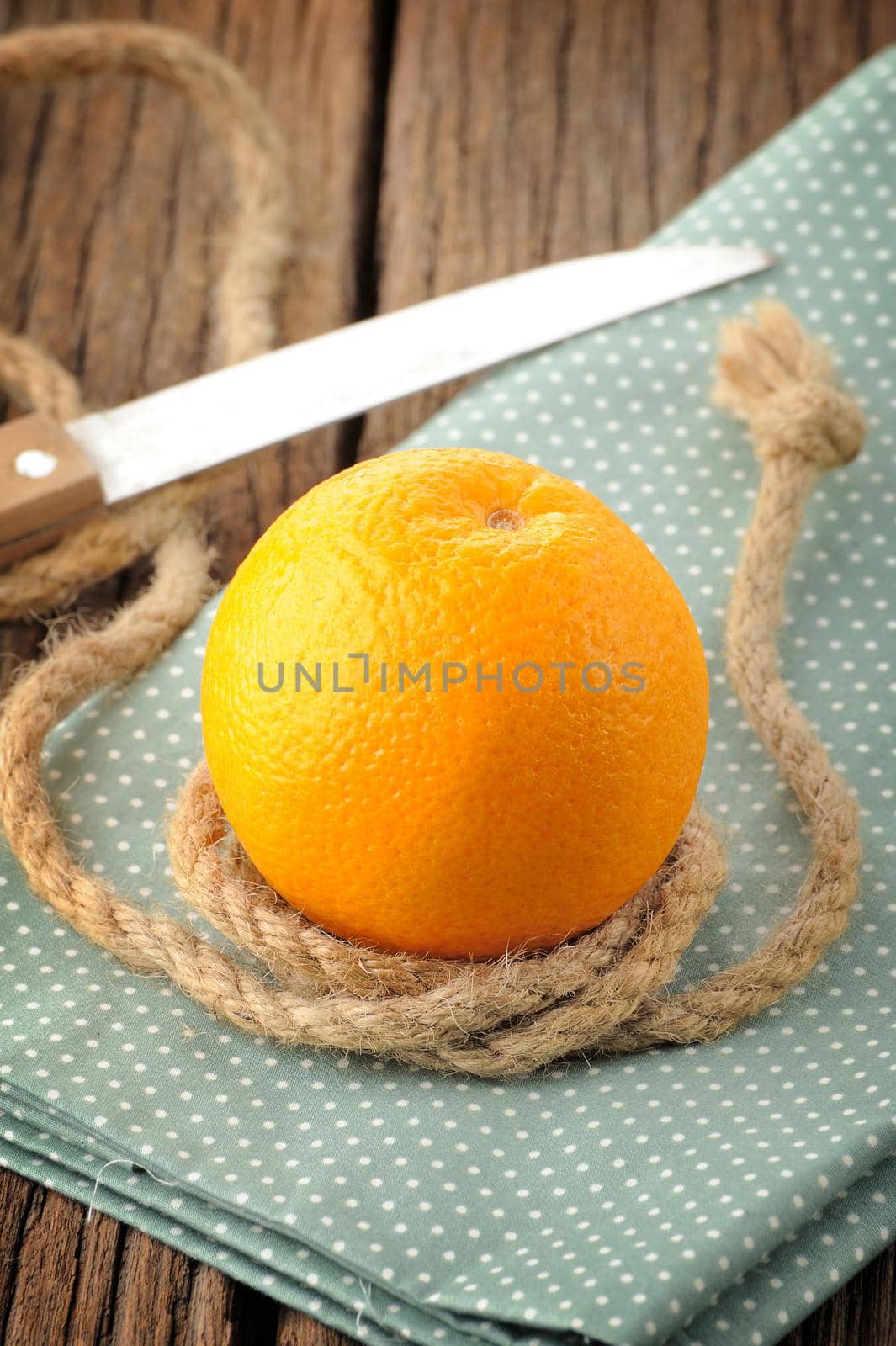 Ripe orange on wooden table