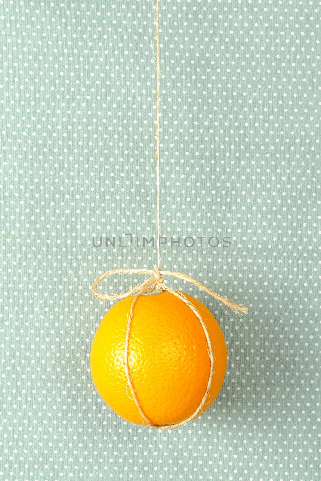 hanging ripe orange with rope