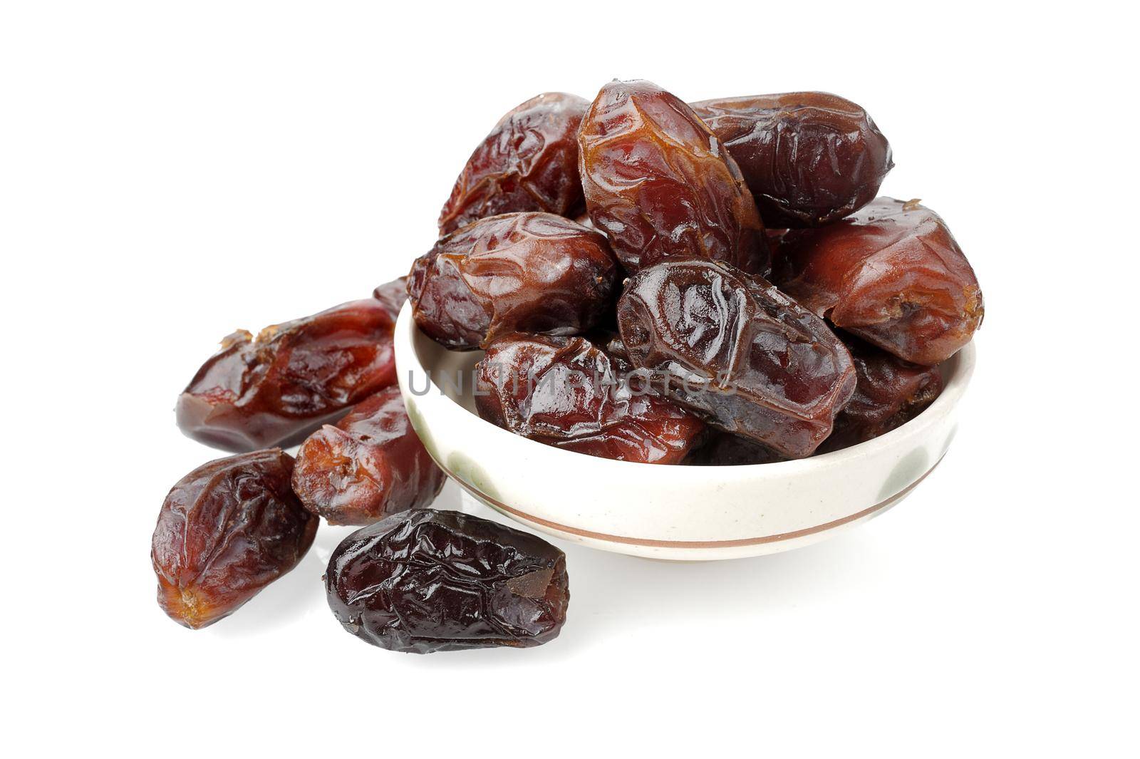 closeup sweet dried dates fruit isolated on white background