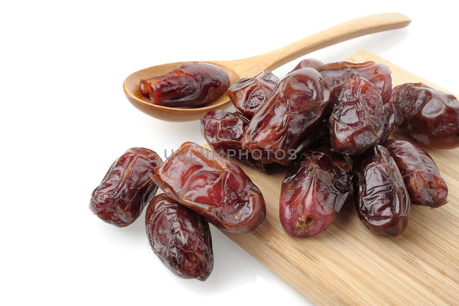 closeup sweet dried dates fruit isolated on white background