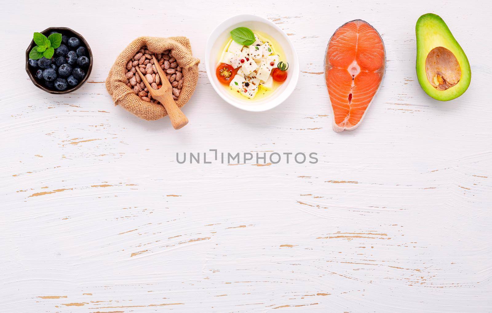 Ketogenic low carbs diet concept. Ingredients for healthy foods selection set up on white concrete background.  by kerdkanno