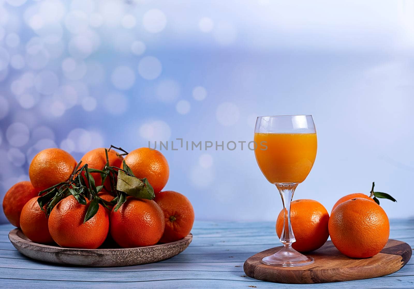 Orange juice with group of oranges by raul_ruiz