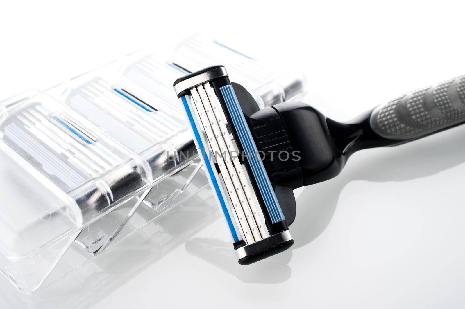 closeup new multiple blade razor on white background