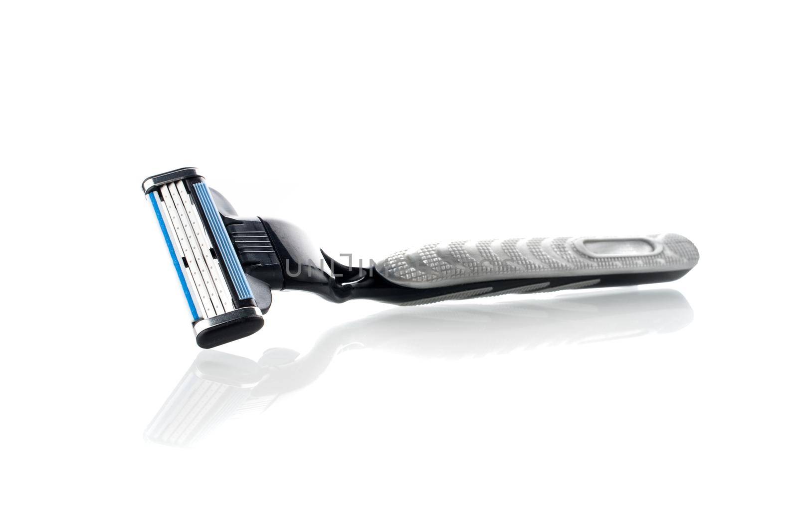 closeup new multiple blade razor on white background