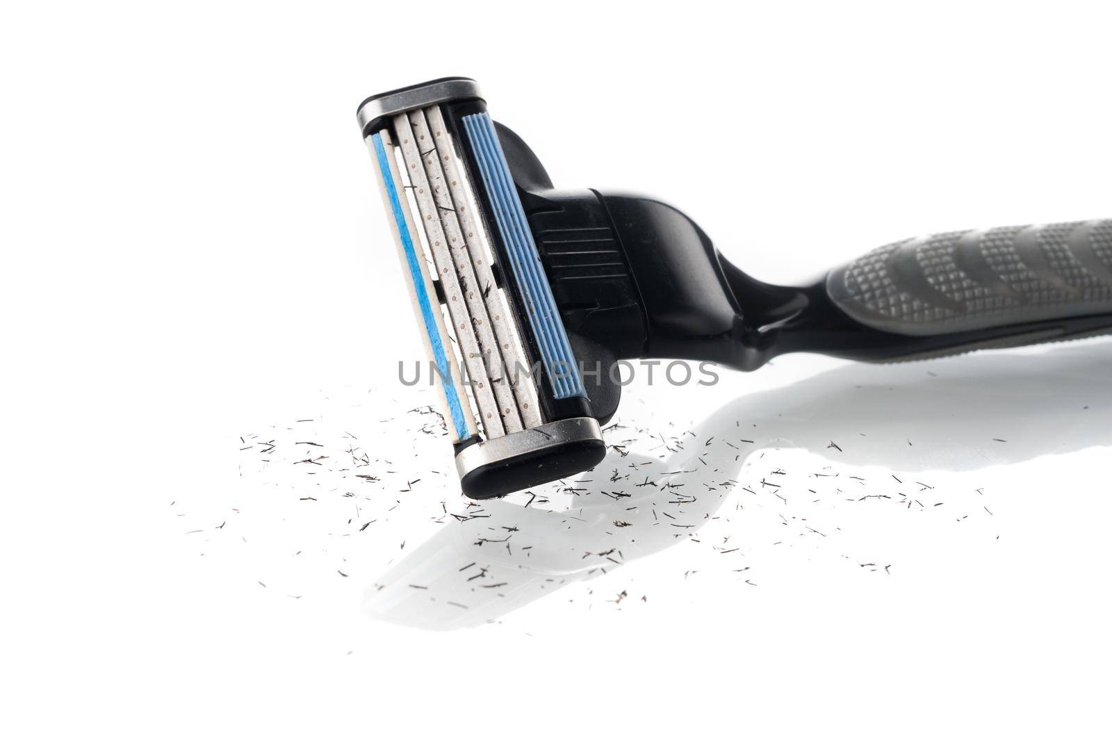 closeup used multiple blade razor on white background