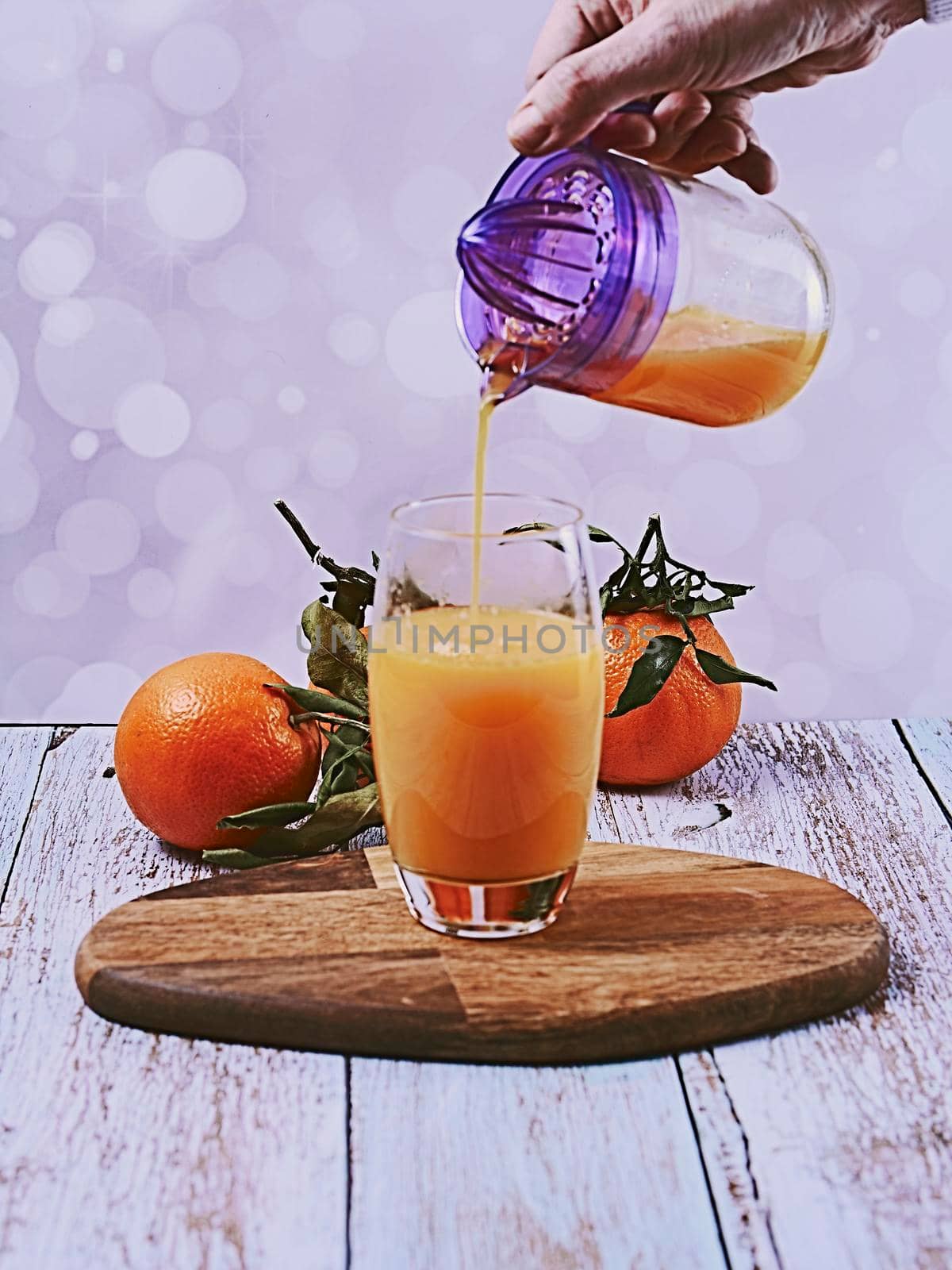 Orange juice with several oranges by raul_ruiz