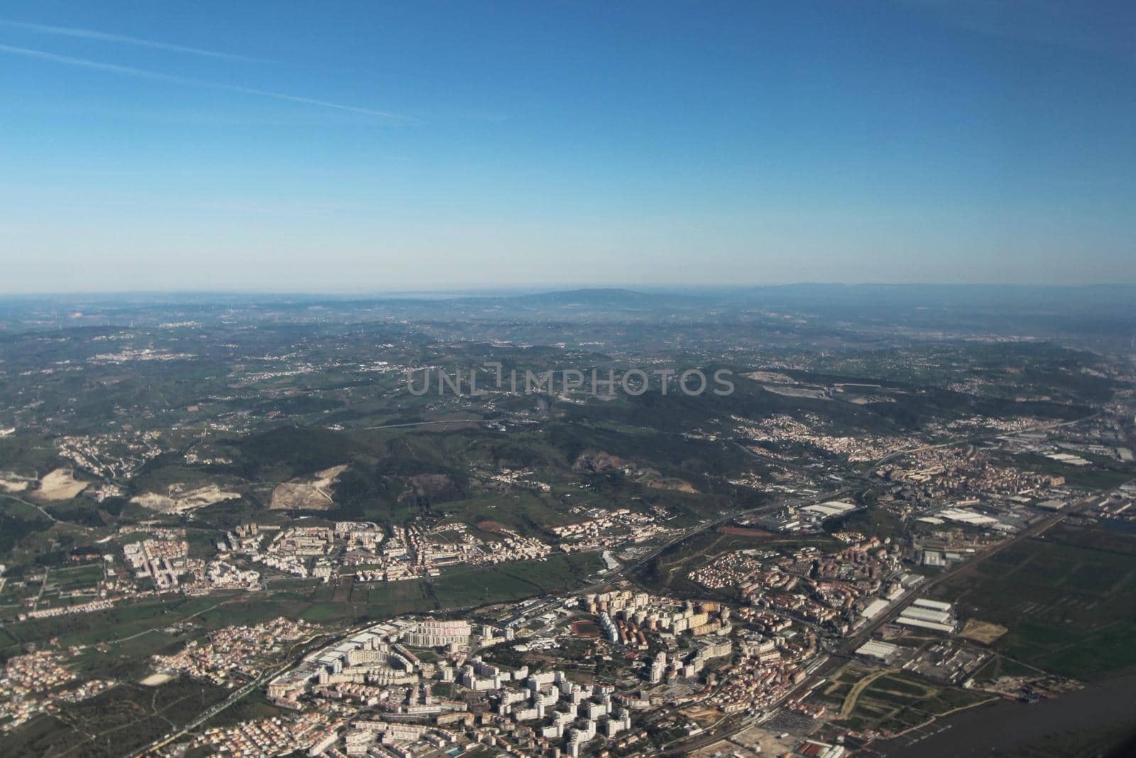 Aerial view of Lisbon landscape from a plane in a clear day of March