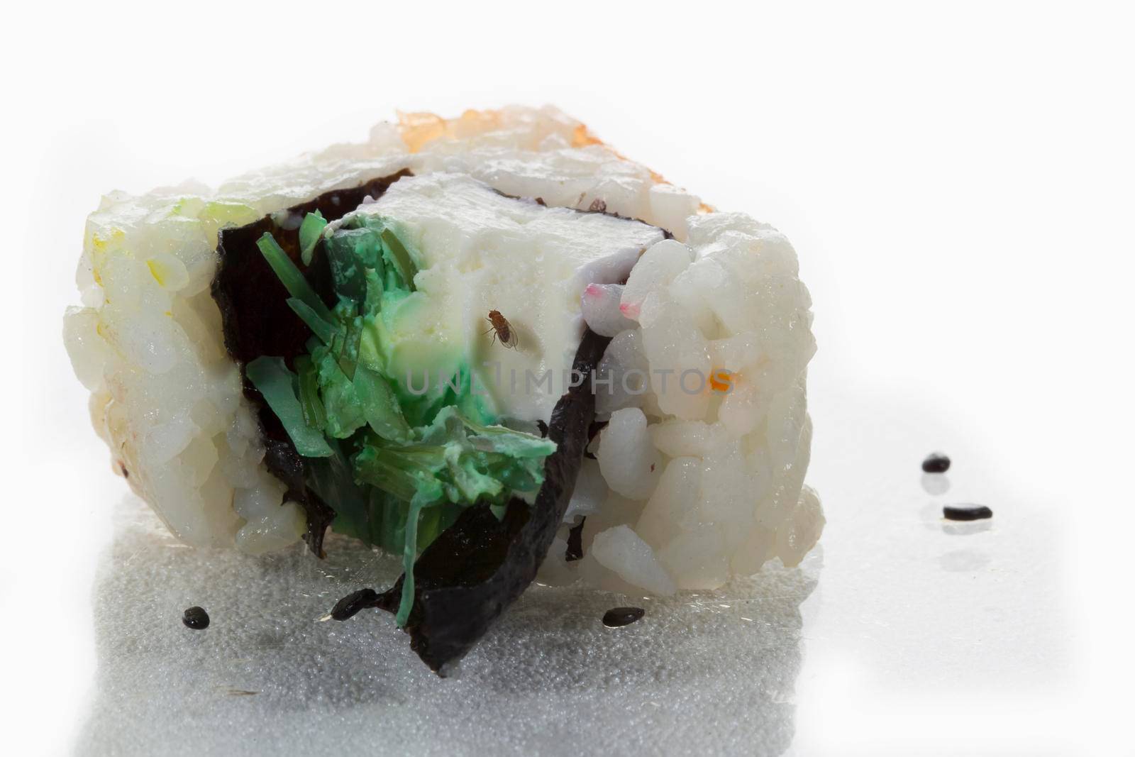 Spoiled sushi with a fly