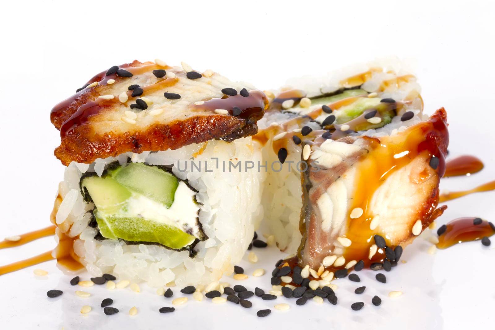Sushi rolls japanese food isolated on white background.California Sushi roll with tuna, vegetables and unagi sauce closeup.Japanese Restaurant Menu.