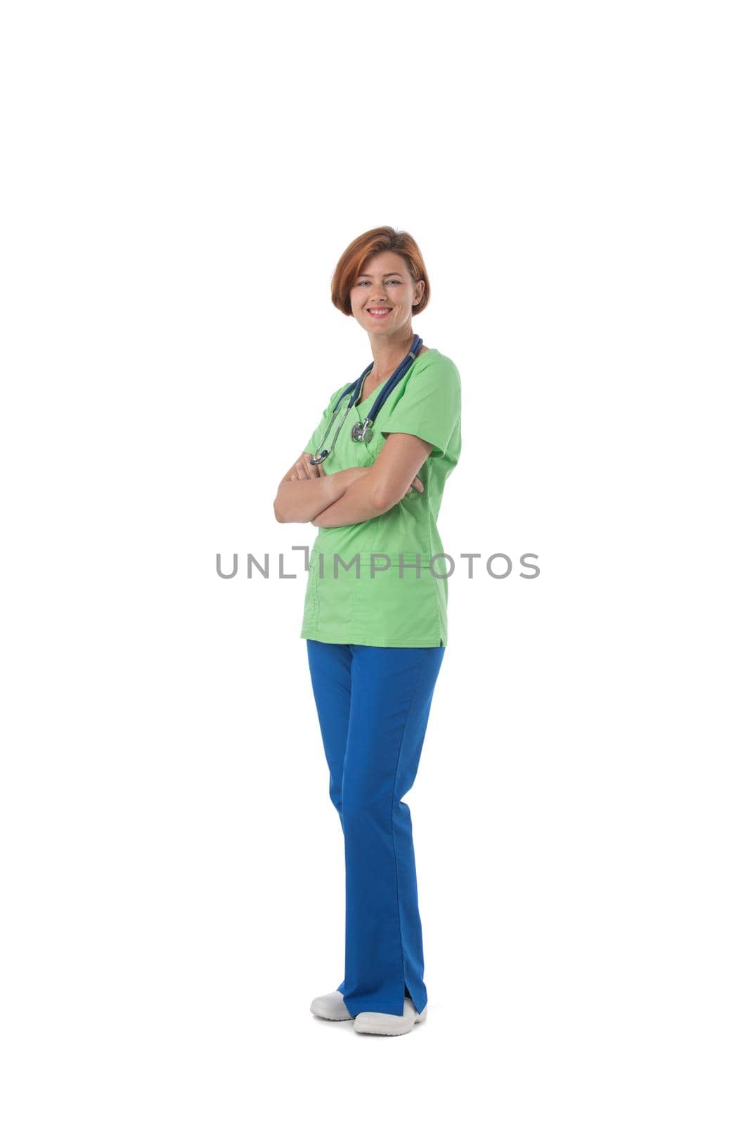 Smiling young woman health care worker standing with arms crossed isolated over white background