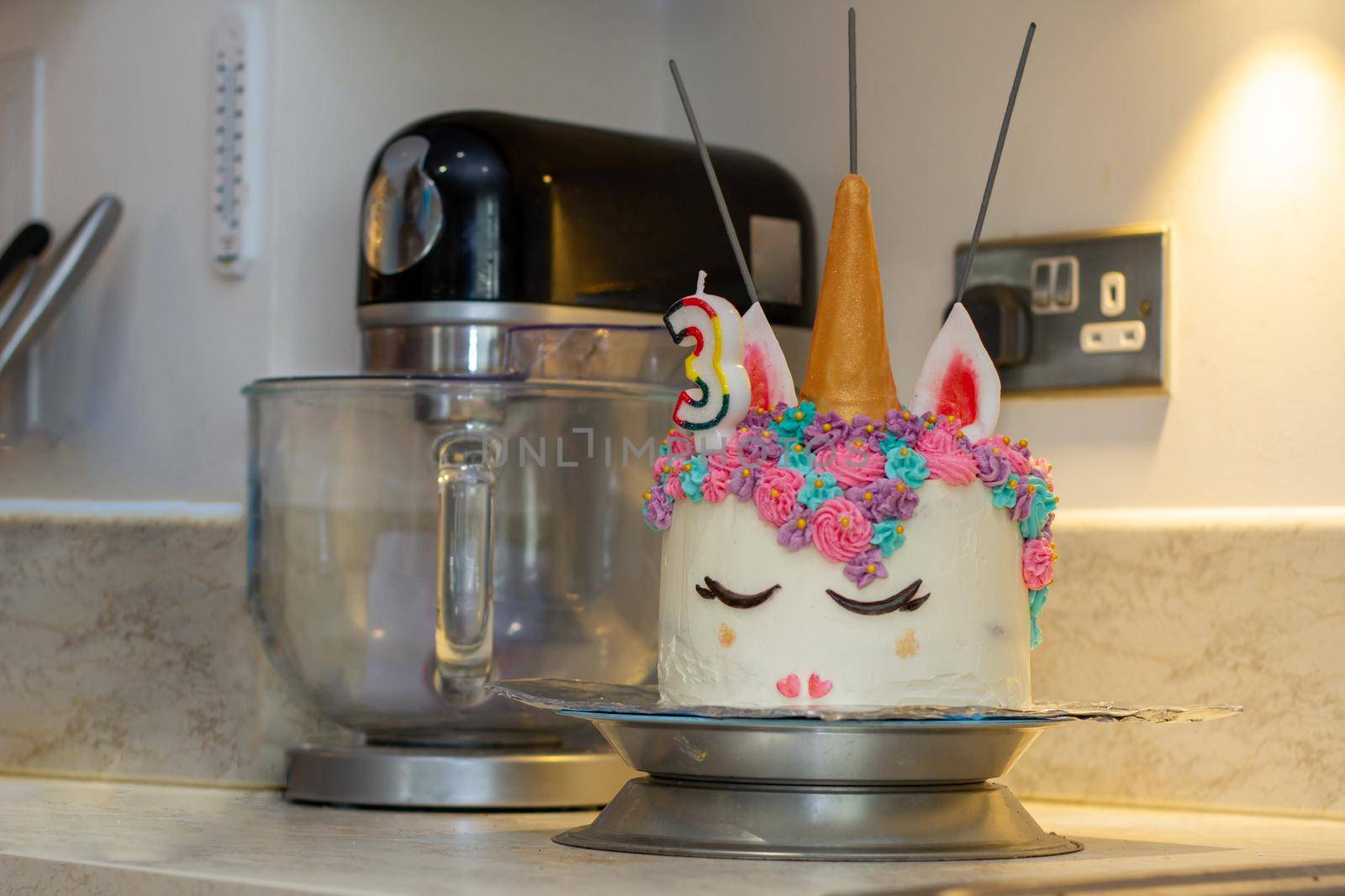 A Unicorn Cake On A Kitchen Corner by AlbertoPascual