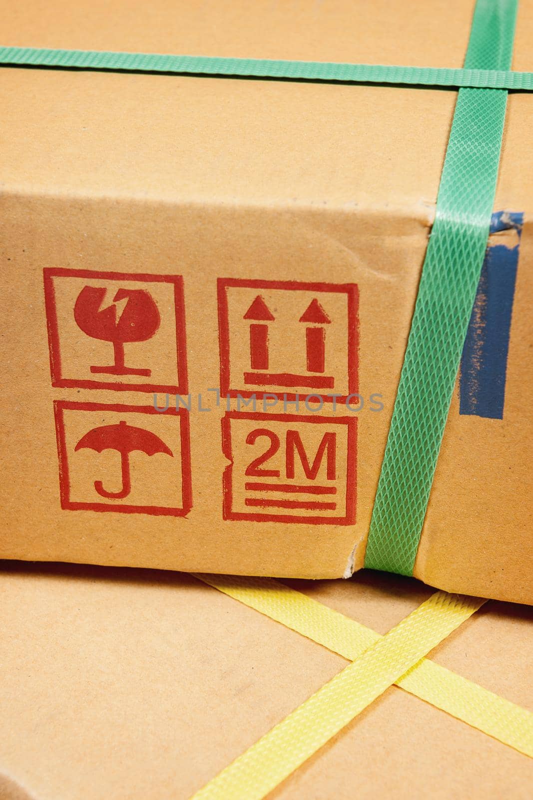 closeup detail of freight parcel with plastic strap