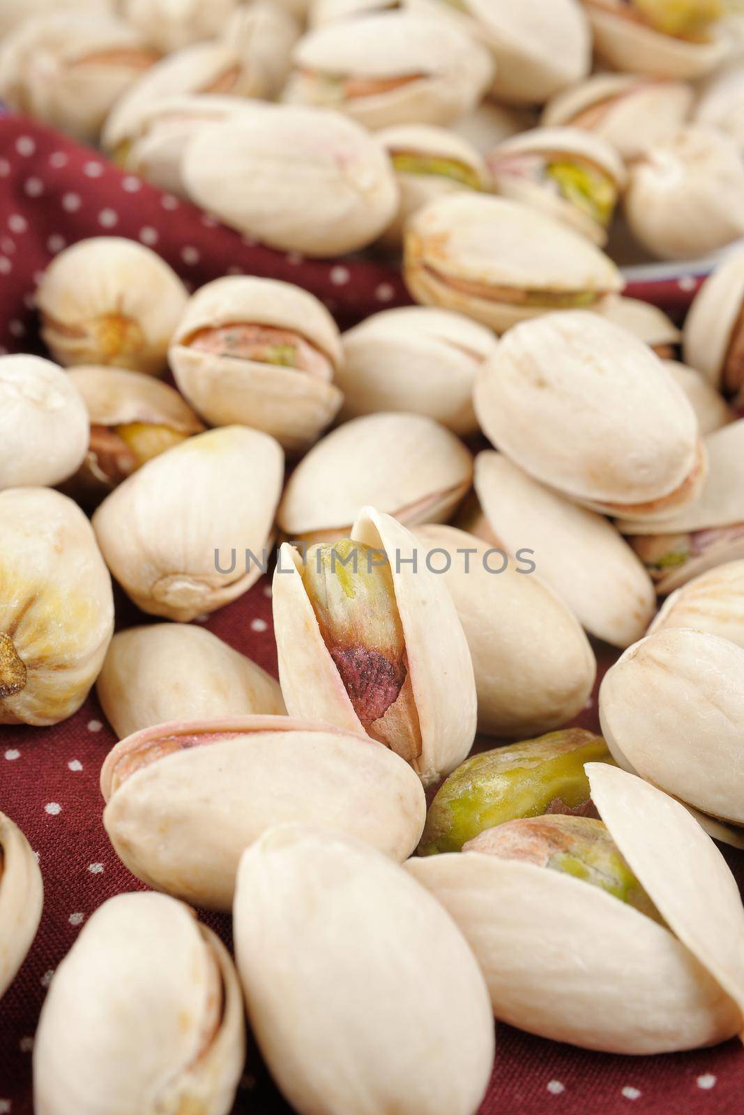 closeup roasted and cracked pistachios