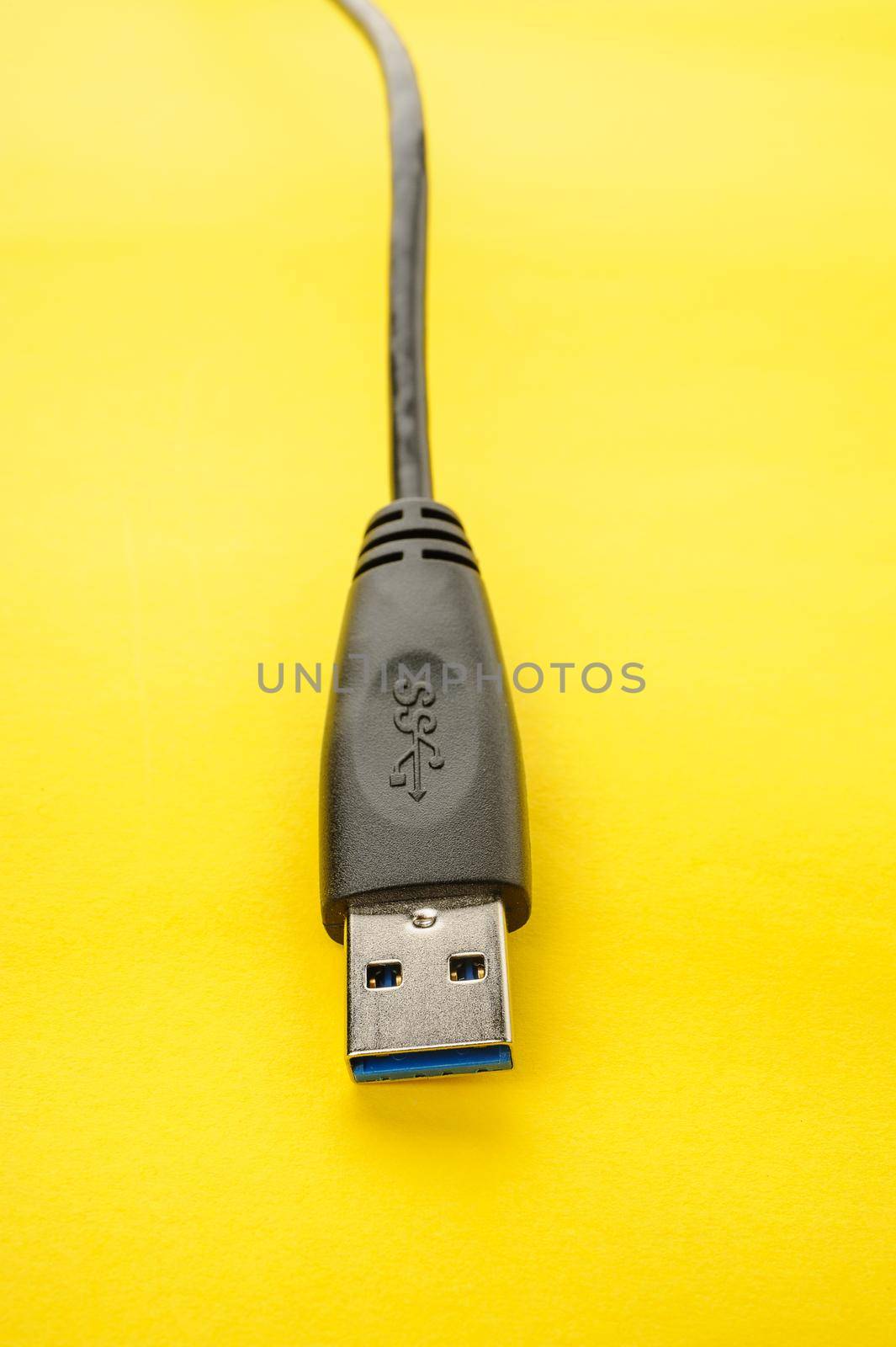 closeup detail of USB 3.0 connector on yellow paper