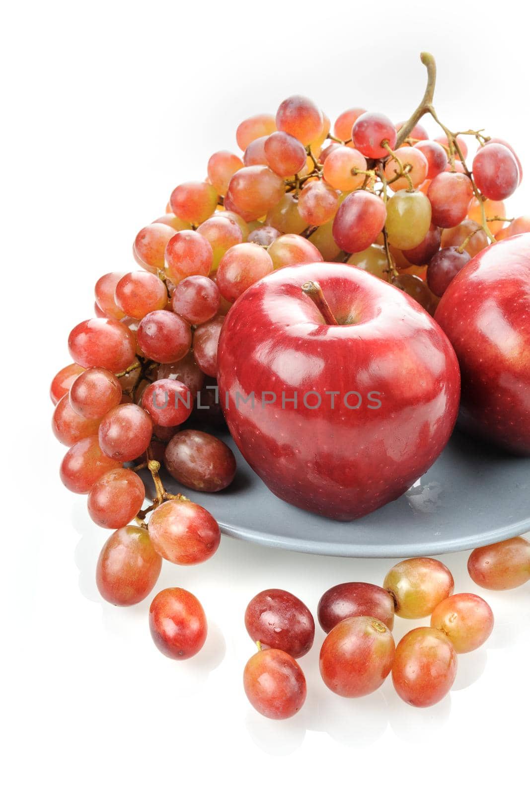 closeup ripe red apples and red grapes