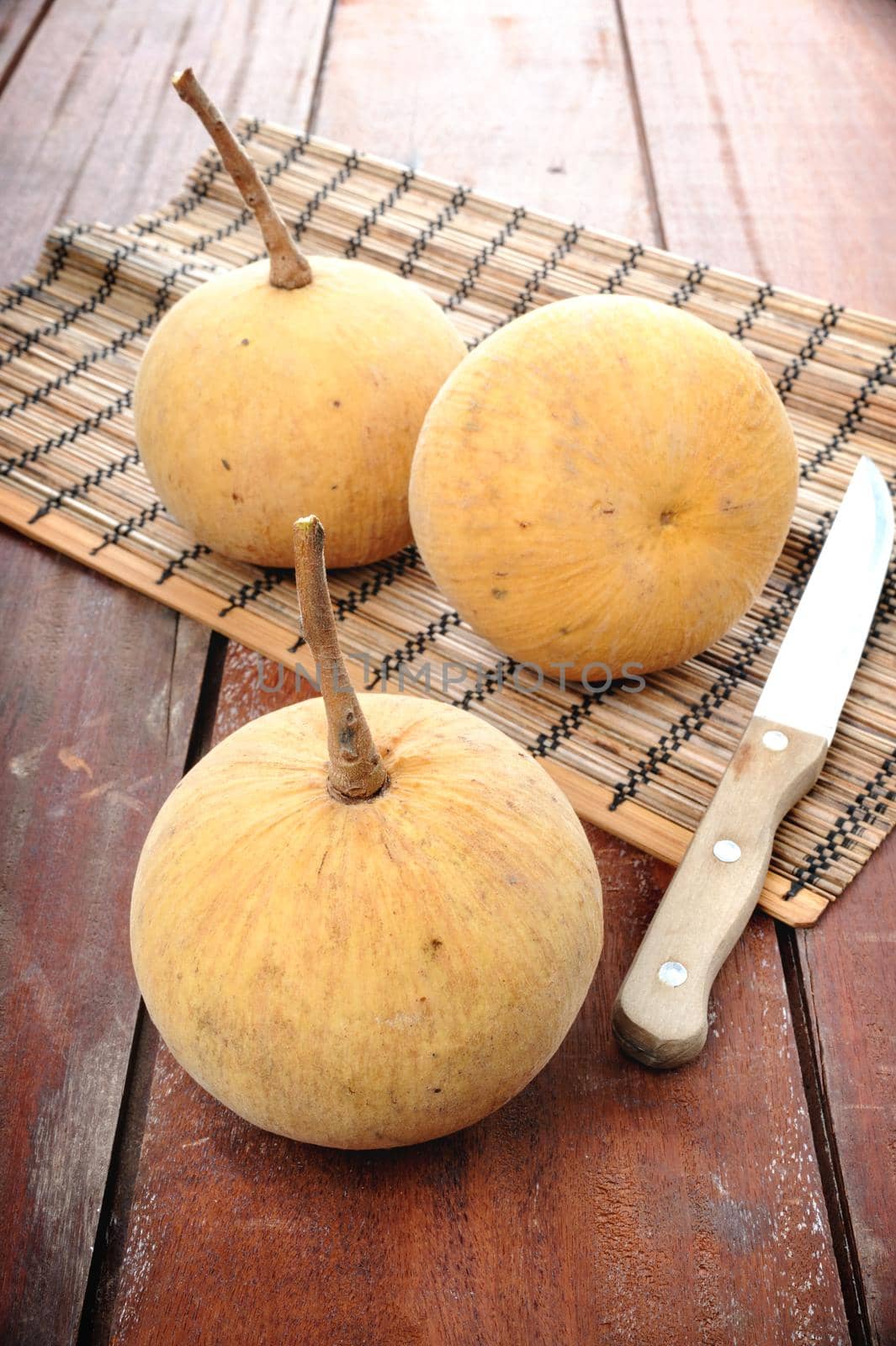 santol on wooden plank, Thai fruit