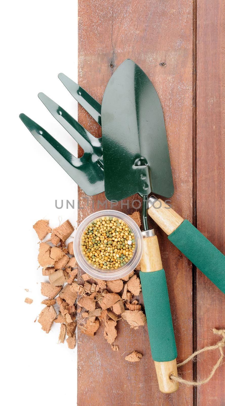 gardening tools on wooden plank background