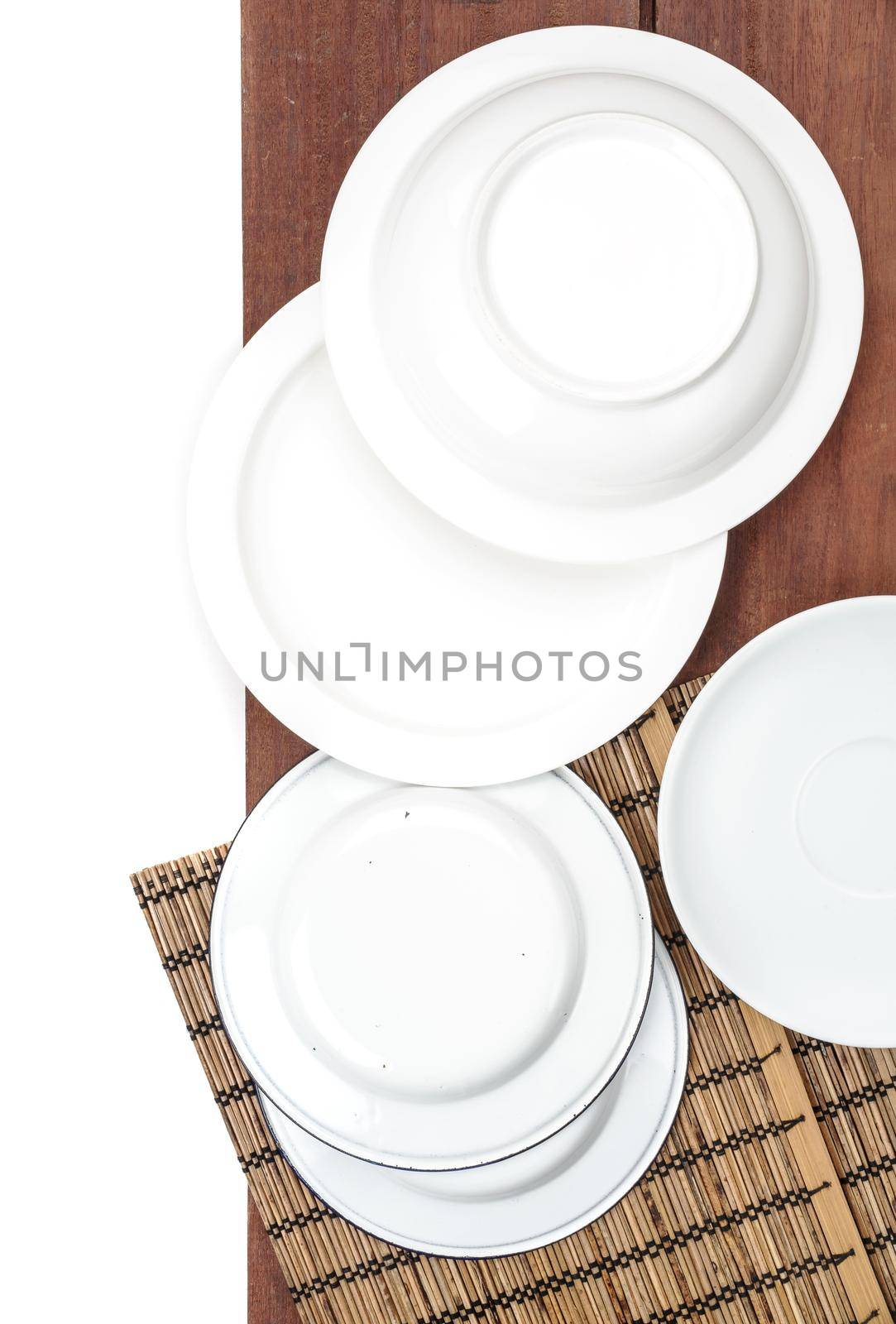 white plate set on wooden plank background