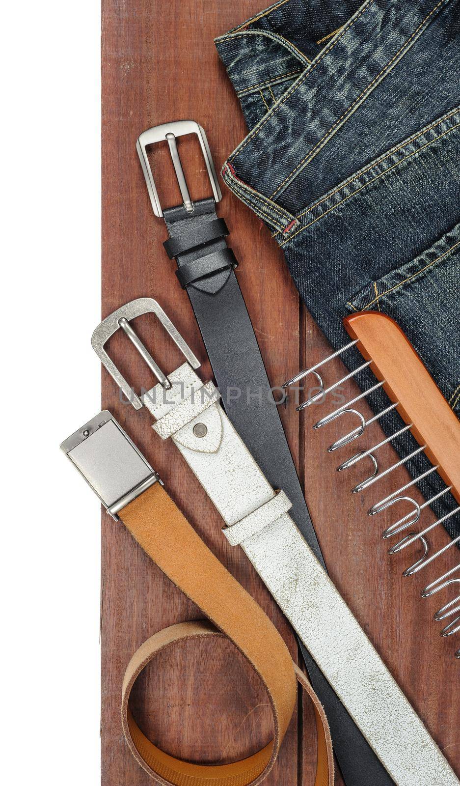 isolate leather belts on wooden plank