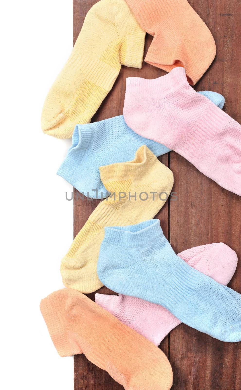 isolated old socks on wooden plank background