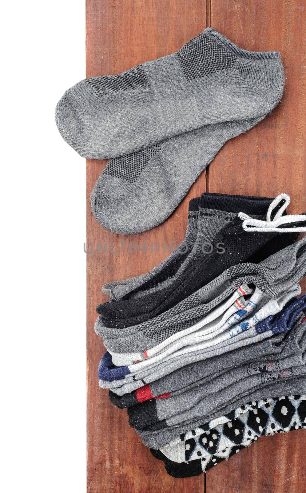 isolated old socks on wooden plank background