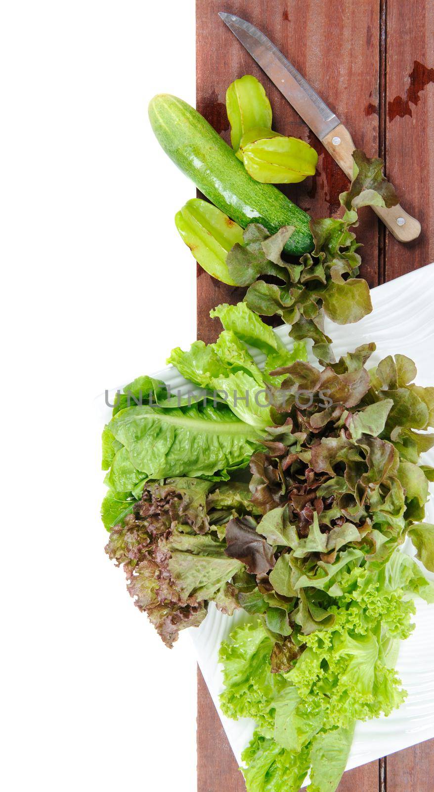 closeup isolate fresh lettuces on wooden plank
