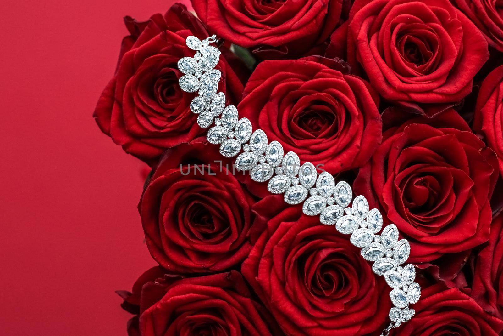 Gemstone jewellery, wedding fashion and luxe shopping concept - Luxury diamond bracelet and bouquet of red roses, jewelry love gift on Valentines Day and romantic holidays present