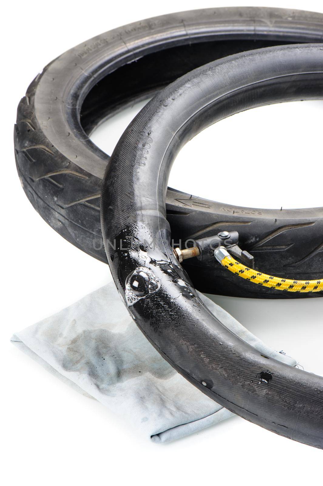 checking damaged inner tire tube, damaged motorbike tire