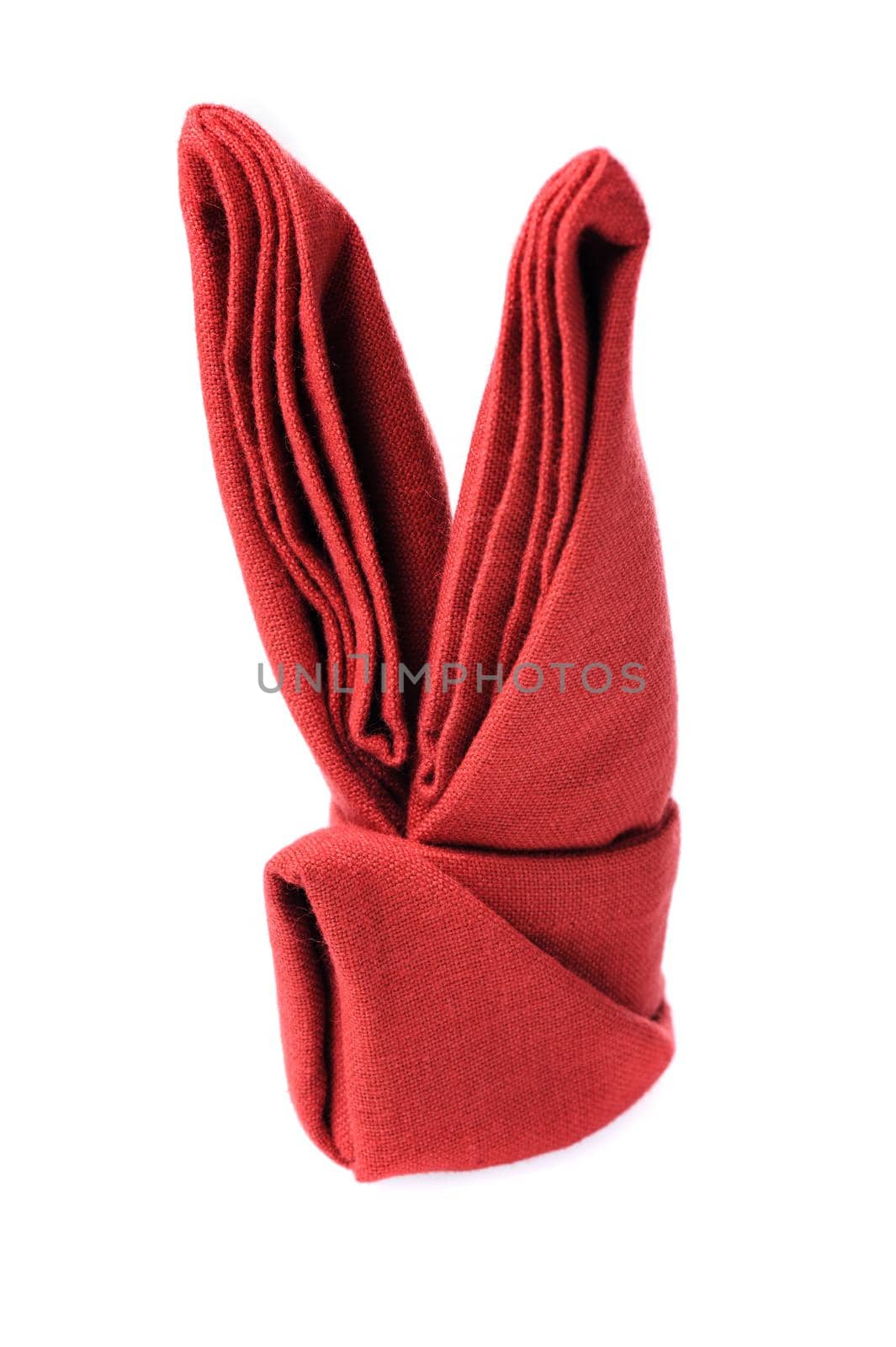 isolated folded red napkin over white background