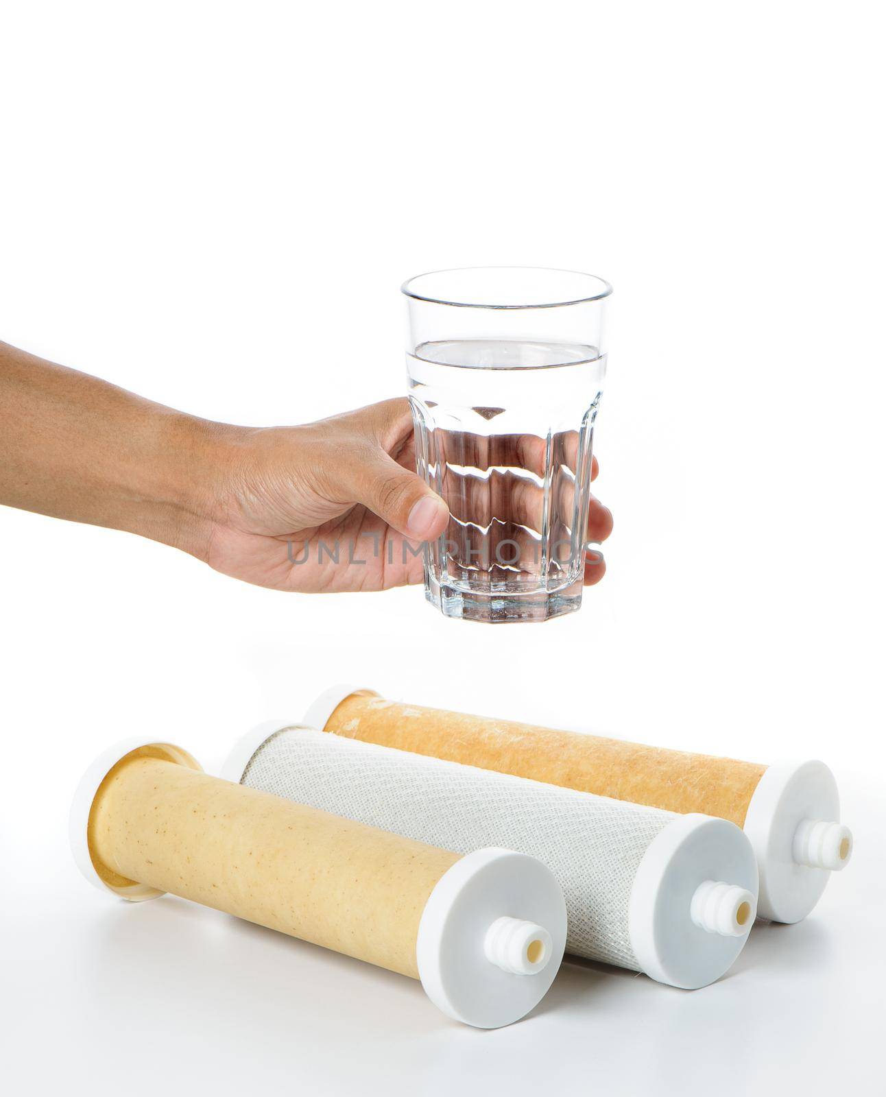 a glass of water in hand with water filter