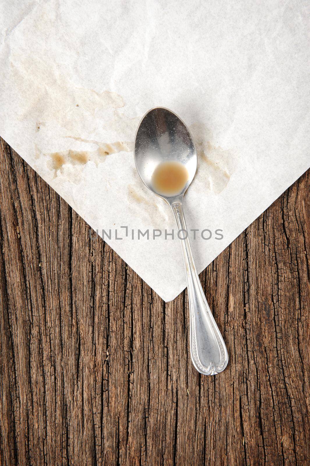 closeup teaspoon on folded paper