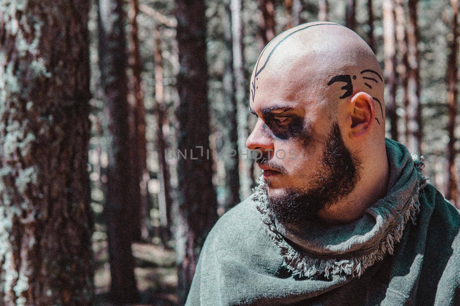 Viking with war paintings in a Norwegian forest by xavier_photo