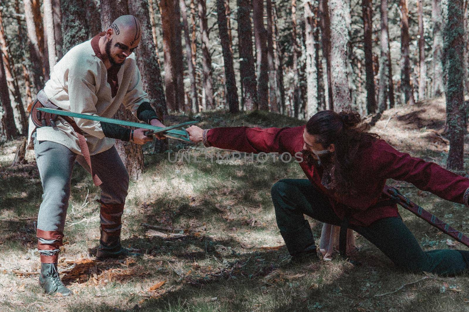 Viking fighting to the death with his swords by xavier_photo