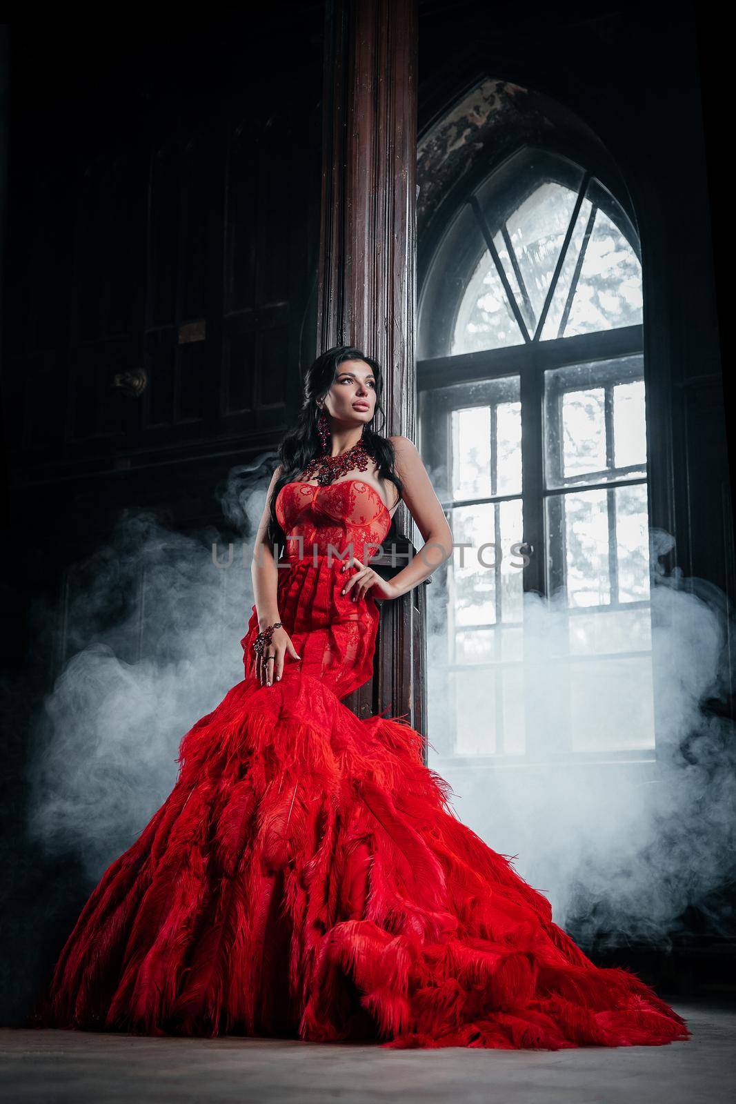 Woman Vintage Red Dress Old Castle Beautiful Princess In Seductive Dress Elegant Caucasian Female Fairy Tale story Near Big Window With Smoke Fog